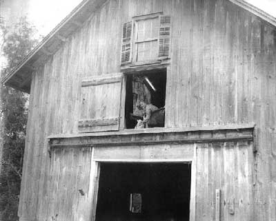 Anni Adkins painting in a barn in New York